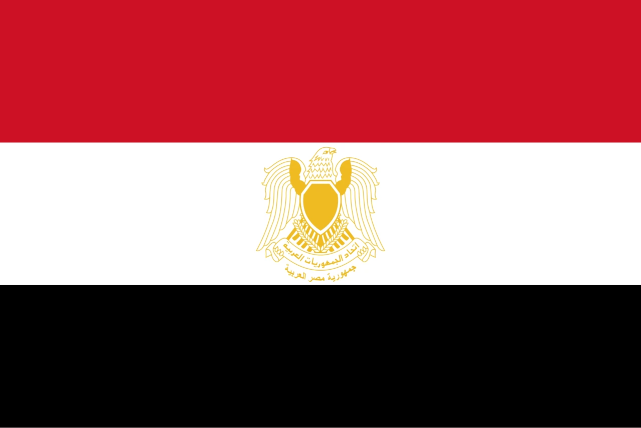 Red, white and black flag with a golden falcon in the centre