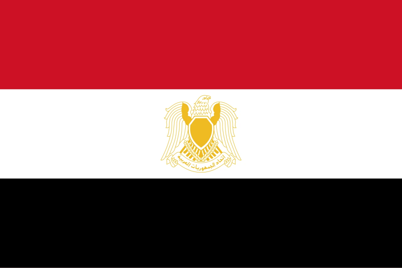 Red, white and black flag with a golden falcon in the centre