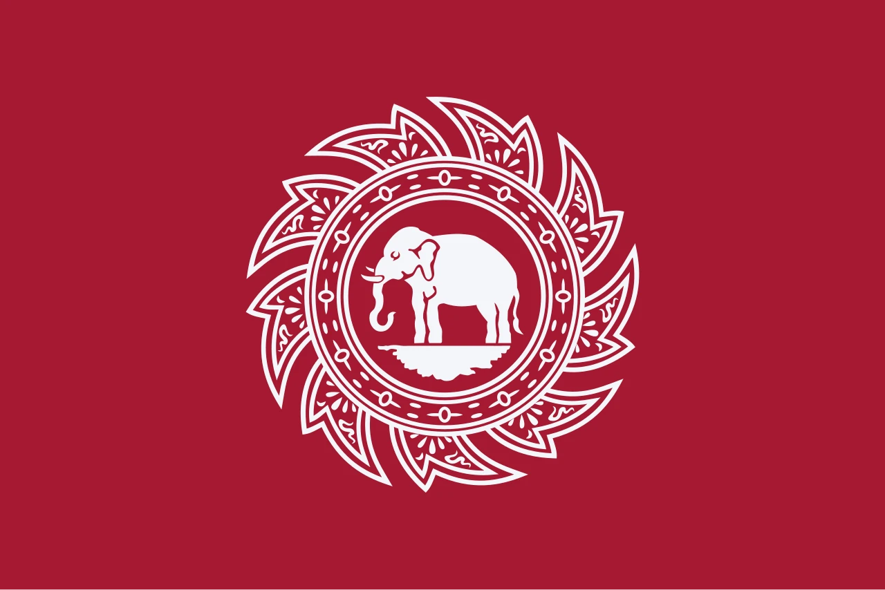 Red flag with a white elephant inside a white wheel